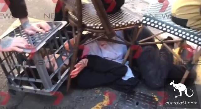 The masked city of Sydney has wounded Asian women and female bodies nearby.